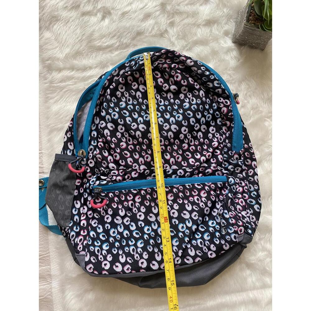 Multi-Color Patterned Backpack With Blue Accents - image 2
